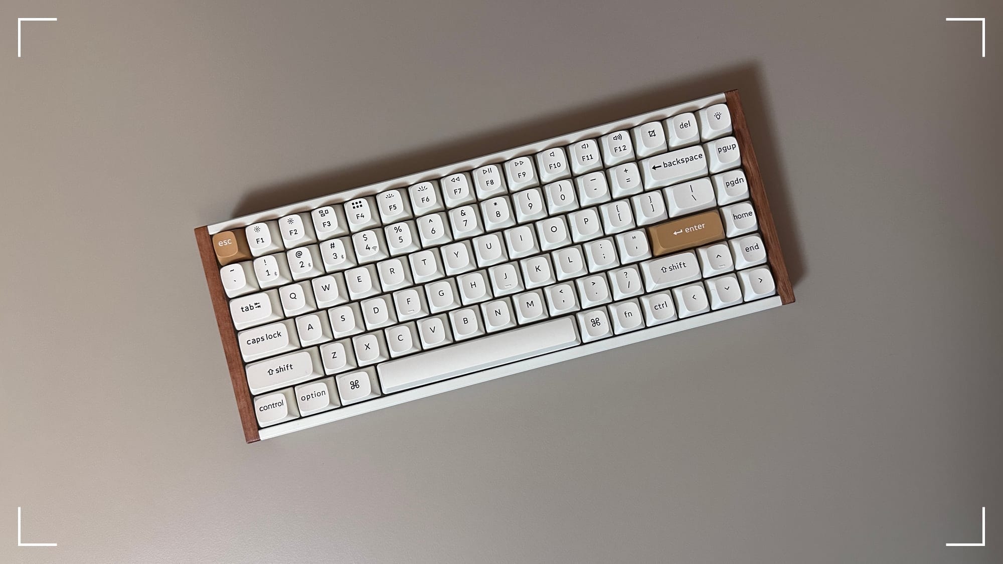 Keychron K2 HE keyboard on a tan background